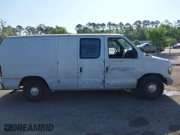 1999 Ford Econoline Cargo with VIN 1FTRE1420XHA34056, listed as a IAAI auction lot 41998411 with 236,267 mi miles. Bid and sale history available at carsss.com. Image 13.