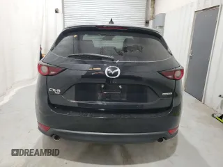 2021 Mazda CX-5 Touring with VIN JM3KFBCM5M0343577, listed as a Copart auction lot 52411005 with 70,372 mi miles and Clean Title. Bid and sale history available at carsss.com. Image 6.