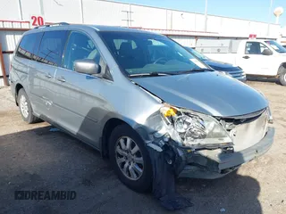 2010 Honda Odyssey EX z VIN 5FNRL3H46AB038746, wystawiony jako IAAI lot #41703297 z przebiegiem 173 592 mil mil oraz . Historia ofert i sprzedaży dostępna na DreamBid. Obrazek 1.