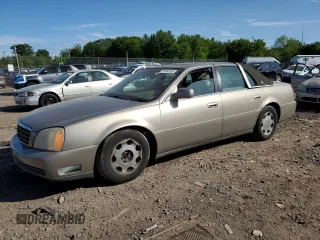 2001 Cadillac DeVille DHS z VIN 1G6KE57Y21U250470, wystawiony jako Copart lot #57334785 z przebiegiem 66 703 mil mil oraz Tytuł czysty. Historia ofert i sprzedaży dostępna na DreamBid. Obrazek 1.