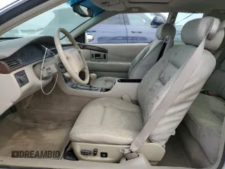 1999 Cadillac Eldorado z VIN 1G6EL12Y7XU615169, wystawiony jako Copart lot #76459744 z przebiegiem Nie podano mil oraz Szkoda całkowita • Salvage title. Historia ofert i sprzedaży dostępna na DreamBid. Obrazek 7.