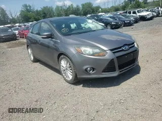 2014 Ford Focus Titanium z VIN 1FADP3N27EL462950, wystawiony jako Copart lot #65207155 z przebiegiem 34 058 mil mil oraz Szkoda całkowita • Salvage title. Historia ofert i sprzedaży dostępna na DreamBid. Obrazek 13.