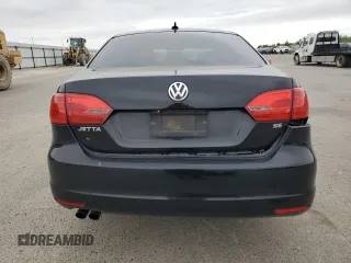 2014 Volkswagen Jetta SE with VIN 3VWD17AJ2EM381057, listed as a Copart auction lot 54267475 with 187,770 mi miles and Salvage title. Bid and sale history available at DreamBid. Image 6.