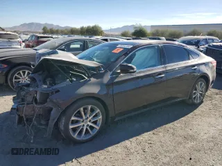 2014 Toyota Avalon Limited z VIN 4T1BK1EB6EU082508, wystawiony jako Copart lot #86912384 z przebiegiem 89 464 mil mil oraz Szkoda całkowita • Salvage title. Historia ofert i sprzedaży dostępna na DreamBid. Obrazek 1.