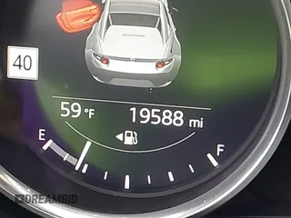 2020 Mazda MX-5 Miata Grand Touring z VIN JM1NDAM77L0418499, wystawiony jako IAAI lot #42010802 z przebiegiem 19 588 mil mil oraz . Historia ofert i sprzedaży dostępna na DreamBid. Obrazek 15.