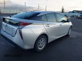 2018 Toyota Prius Two with VIN JTDKARFU8J3547408, listed as a IAAI auction lot 41313198 with 76,060 mi miles. Bid and sale history available at carsss.com. Image 4.