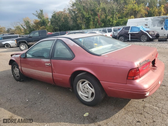 1996 Ford Thunderbird LX with VIN 1FALP62W7TH135632, listed as a Copart auction lot 77134024 with 128,931 mi miles and Salvage Title. Bid and sale history available at carsss.com. Image 2.