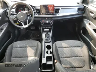 2023 Kia Rio S with VIN 3KPA24AD3PE597752, listed as a Copart auction lot 64836674 with 8,434 mi miles and Salvage Title. Bid and sale history available at carsss.com. Image 8.