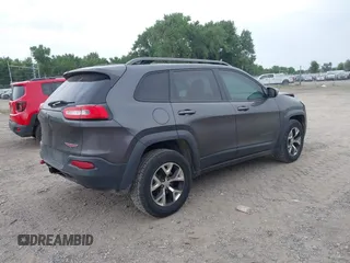 2015 Jeep Cherokee Trailhawk with VIN 1C4PJMBSXFW654754, listed as a IAAI auction lot 39935278 with 128,076 mi miles and . Bid and sale history available at DreamBid. Image 4.