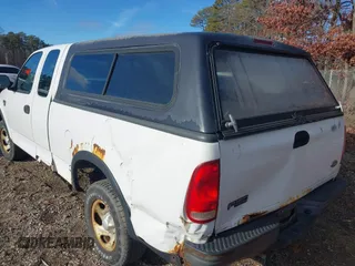 2003 Ford F-150 XL with VIN 2FTRX18W43CA62452, listed as a IAAI auction lot 41497879 with 125,828 mi miles. Bid and sale history available at carsss.com. Image 3.