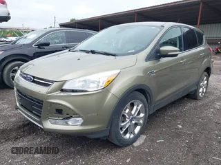 2013 Ford Escape SEL with VIN 1FMCU9H9XDUB61880, listed as a IAAI auction lot 42271136 with 115,837 mi miles and . Bid and sale history available at DreamBid. Image 2.
