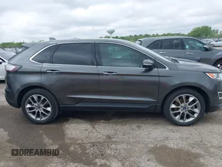 2015 Ford Edge Titanium z VIN 2FMTK3K81FBB88882, wystawiony jako IAAI lot #42184698 z przebiegiem 161 858 mil mil oraz . Historia ofert i sprzedaży dostępna na DreamBid. Obrazek 13.