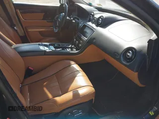 2013 Jaguar XJ Portfolio with VIN SAJWJ2GDXD8V55879, listed as a IAAI auction lot 41568366 with 121,119 mi miles and . Bid and sale history available at DreamBid. Image 5.