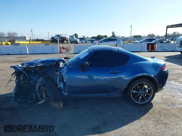 2020 Mazda MX-5 Miata Grand Touring z VIN JM1NDAM75L0412507, wystawiony jako IAAI lot #41573544 z przebiegiem Nie podano mil oraz . Historia ofert i sprzedaży dostępna na DreamBid. Obrazek 14.