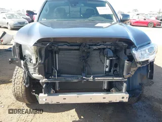 2022 Toyota Tacoma SR with VIN 3TYRX5GN3NT066696, listed as a IAAI auction lot 42514462 with 35,687 mi miles and . Bid and sale history available at DreamBid. Image 6.