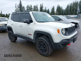 2017 Jeep Renegade Trailhawk z VIN ZACCJBCB6HPE79727, wystawiony jako IAAI lot #41851367 z przebiegiem 90 645 mil mil oraz . Historia ofert i sprzedaży dostępna na DreamBid. Obrazek 1.