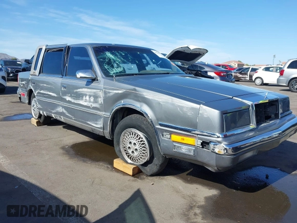 1991 Chrysler New Yorker z VIN 1C3XY66R2MD228813, wystawiony jako IAAI lot #42257734 z przebiegiem 45 786 mil mil oraz . Historia ofert i sprzedaży dostępna na DreamBid. Obrazek 1.