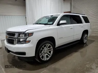 2019 Chevrolet Tahoe LS z VIN 1GNSKAKC7KR279792, wystawiony jako Copart lot #59736665 z przebiegiem 103 984 mil mil oraz Szkoda całkowita • Salvage title. Historia ofert i sprzedaży dostępna na DreamBid. Obrazek 1.