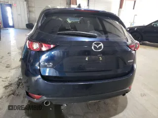 2021 Mazda CX-5 Grand Touring with VIN JM3KFBDM3M0327635, listed as a Copart auction lot 49980635 with 47,160 mi miles and Salvage Title. Bid and sale history available at carsss.com. Image 6.