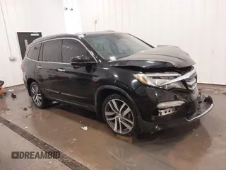2018 Honda Pilot Touring with VIN 5FNYF6H94JB025087, listed as a IAAI auction lot 42196070 with 77,115 mi miles and . Bid and sale history available at DreamBid. Image 1.
