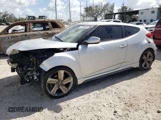 2015 Hyundai Veloster Turbo z VIN KMHTC6AE6FU228258, wystawiony jako Copart lot #77105564 z przebiegiem Nie podano mil oraz Szkoda całkowita • Salvage title. Historia ofert i sprzedaży dostępna na DreamBid. Obrazek 1.