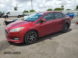 2015 Ford Focus SE with VIN 1FADP3F24FL332883, listed as a Copart auction lot 64429655 with 65,939 mi miles and Salvage title. Bid and sale history available at DreamBid. Image 1.
