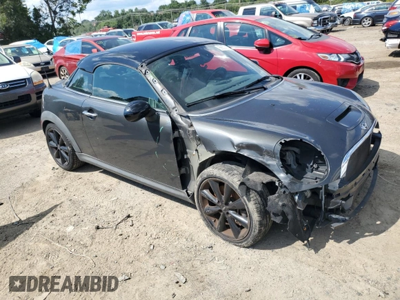 2015 MINI Coupe S z VIN WMWSX3C55FT409449, wystawiony jako Copart lot #66574174 z przebiegiem 99 155 mil mil oraz Szkody całkowita. Historia ofert i sprzedaży dostępna na DreamBid. Obrazek 4.