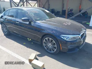 2018 BMW 5 Series 530e xDrive with VIN WBAJB1C51JB374308, listed as a IAAI auction lot 41965038 with 122,791 mi miles and . Bid and sale history available at carsss.com. Image 1.