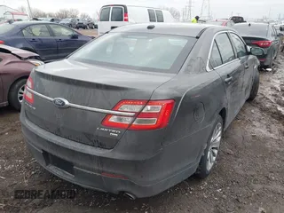 2015 Ford Taurus Limited with VIN 1FAHP2J88FG153326, listed as a IAAI auction lot 41465344 with 98,727 mi miles. Bid and sale history available at carsss.com. Image 4.