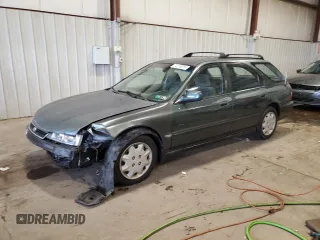 1996 Honda Accord LX with VIN 1HGCE1829TA001562, listed as a Copart auction lot 74019814 with 153,196 mi miles and Salvage Title. Bid and sale history available at carsss.com. Image 1.