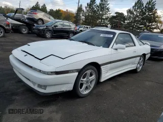 1987 Toyota Supra z VIN JT2MA70L2H0044216, wystawiony jako Copart lot #78864694 z przebiegiem 143 418 mil mil oraz Czysty tytuł • Clean title. Historia ofert i sprzedaży dostępna na DreamBid. Obrazek 1.
