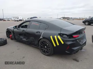 2023 BMW M8 Competition with VIN WBSGV0C03PCM74103, listed as a IAAI auction lot 40976144 with 21,035 mi miles. Bid and sale history available at carsss.com. Image 3.