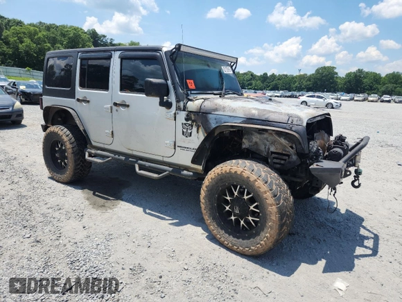 2007 Jeep Wrangler Unlimited Sahara с VIN 1J4GA59167L183198, выставлен на аукционе Copart как лот 62135995 с пробегом Не указан миль и Списание • Salvage title. История ставок и продаж доступна на DreamBid. Изображение 4.