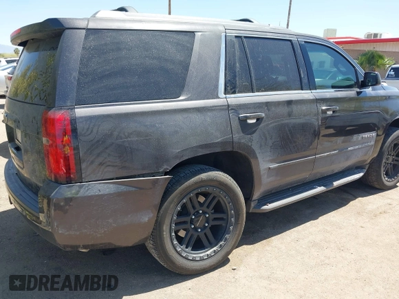 2017 Chevrolet Tahoe LS with VIN 1GNSCAKC3HR328833, listed as a IAAI auction lot 41993364 with 124,817 mi miles and . Bid and sale history available at DreamBid. Image 4.