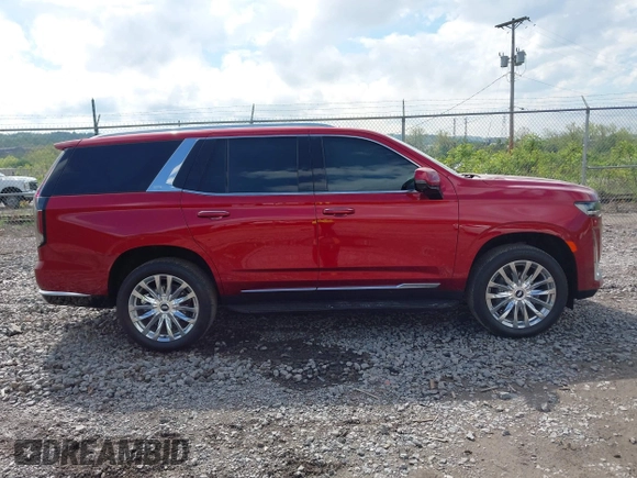 2021 Cadillac Escalade Premium Luxury z VIN 1GYS4BKL6MR453583, wystawiony jako IAAI lot #42129264 z przebiegiem 11 322 mil mil oraz . Historia ofert i sprzedaży dostępna na DreamBid. Obrazek 13.
