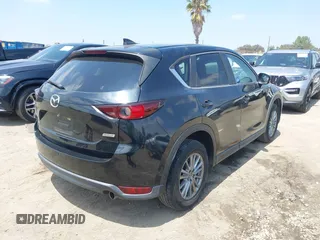 2017 Mazda CX-5 Touring with VIN JM3KFACL0H0124632, listed as a IAAI auction lot 42134971 with 107,029 mi miles and . Bid and sale history available at carsss.com. Image 4.