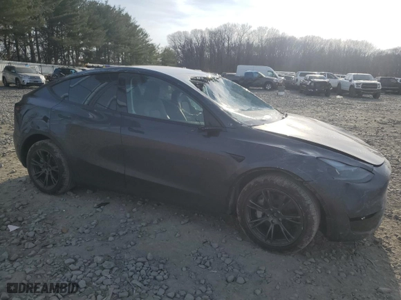 2025 Tesla Model Y Long Range with VIN 7SAYGDEE9SF224174, listed as a Copart auction lot 48988195 with 5,696 mi miles and Salvage Title. Bid and sale history available at carsss.com. Image 4.