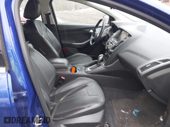 2014 Ford Focus Titanium with VIN 1FADP3J28EL240911, listed as a IAAI auction lot 42082812 with 144,625 mi miles. Bid and sale history available at carsss.com. Image 5.