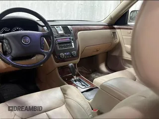 2007 Cadillac DTS V8 z VIN 1G6KD57Y27U198589, wystawiony jako Copart lot #59233755 z przebiegiem 171 023 mil mil oraz Tytuł czysty. Historia ofert i sprzedaży dostępna na DreamBid. Obrazek 9.