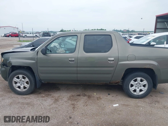 2007 Honda Ridgeline RTL with VIN 2HJYK16517H513832, listed as a IAAI auction lot 42626411 with 209,171 mi miles and . Bid and sale history available at DreamBid. Image 14.