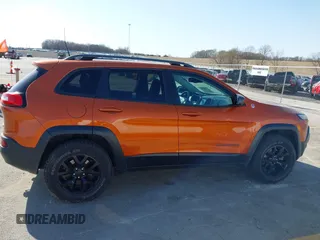 2016 Jeep Cherokee Trailhawk with VIN 1C4PJMBBXGW251682, listed as a IAAI auction lot 41973696 with 100,411 mi miles. Bid and sale history available at carsss.com. Image 14.