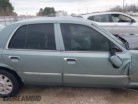 2005 Mercury Grand Marquis LS Premium z VIN 2MEHM75W45X662040, wystawiony jako IAAI lot #41697234 z przebiegiem 214 410 mil mil oraz . Historia ofert i sprzedaży dostępna na DreamBid. Obrazek 14.
