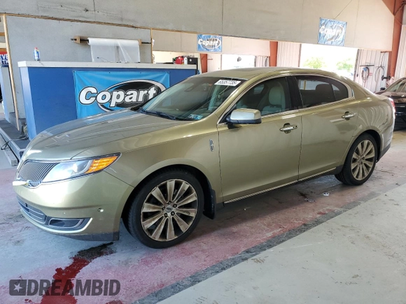 2013 Lincoln MKS EcoBoost with VIN 1LNHL9FT2DG604657, listed as a Copart auction lot 65357735 with 133,548 mi miles and Salvage title. Bid and sale history available at DreamBid. Image 1.