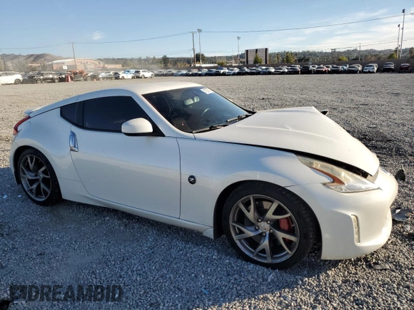 2014 Nissan 370Z Touring with VIN JN1AZ4EH7EM637101, listed as a Copart auction lot 41339705 with 105,841 mi miles and Salvage Title. Bid and sale history available at carsss.com. Image 4.