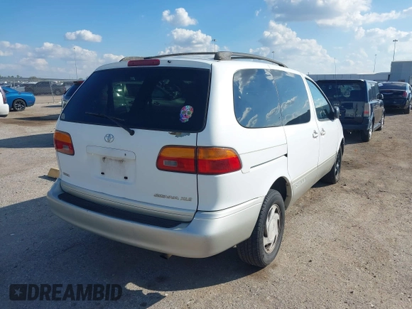 1999 Toyota Sienna LE with VIN 4T3ZF13C1XU152733, listed as a IAAI auction lot 40819395 with 184,540 mi miles. Bid and sale history available at carsss.com. Image 4.