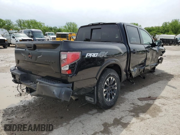 2021 Nissan Titan Pro-4X with VIN 1N6AA1ED0MN528002, listed as a Copart auction lot 54779885 with 33,235 mi miles and Salvage title. Bid and sale history available at DreamBid. Image 3.