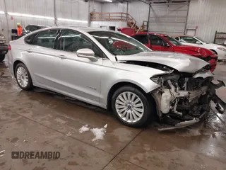 2016 Ford Fusion SE Hybrid z VIN 3FA6P0LU1GR304166, wystawiony jako IAAI lot #41932720 z przebiegiem 68 058 mil mil oraz . Historia ofert i sprzedaży dostępna na DreamBid. Obrazek 1.