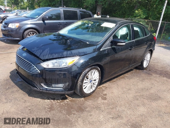 2018 Ford Focus Titanium with VIN 1FADP3J22JL220986, listed as a IAAI auction lot 42410253 with 40,791 mi miles and . Bid and sale history available at DreamBid. Image 2.