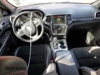 2017 Jeep Grand Cherokee Trailhawk with VIN 1C4RJFLT0HC667691, listed as a Copart auction lot 42041705 with 129,757 mi miles and Salvage title. Bid and sale history available at DreamBid. Image 8.
