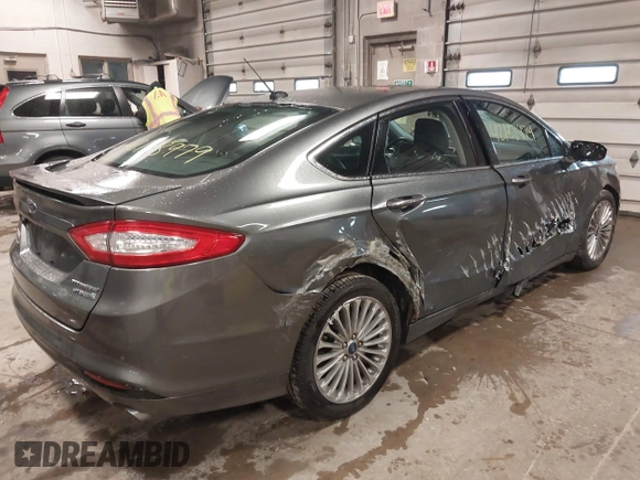 2013 Ford Fusion Titanium Hybrid with VIN 3FA6P0RU6DR319586, listed as a IAAI auction lot 42138979 with 125,388 mi miles. Bid and sale history available at carsss.com. Image 6.